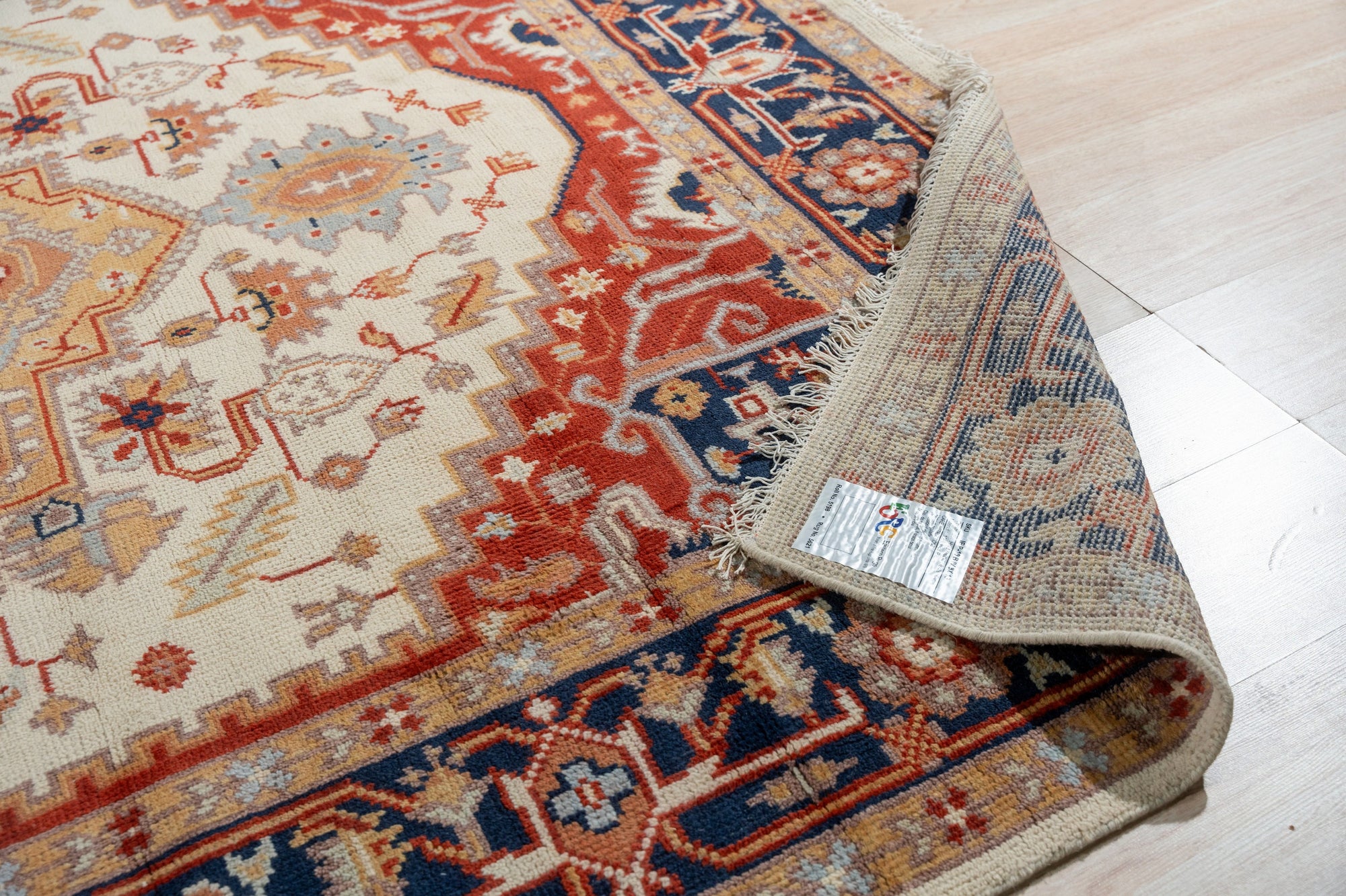 Classic Elegant Blue Hand-Knotted Wool Rug, a calming blue wool rug with intricate knotwork, seen in a well-lit setting, highlighting its texture and design.