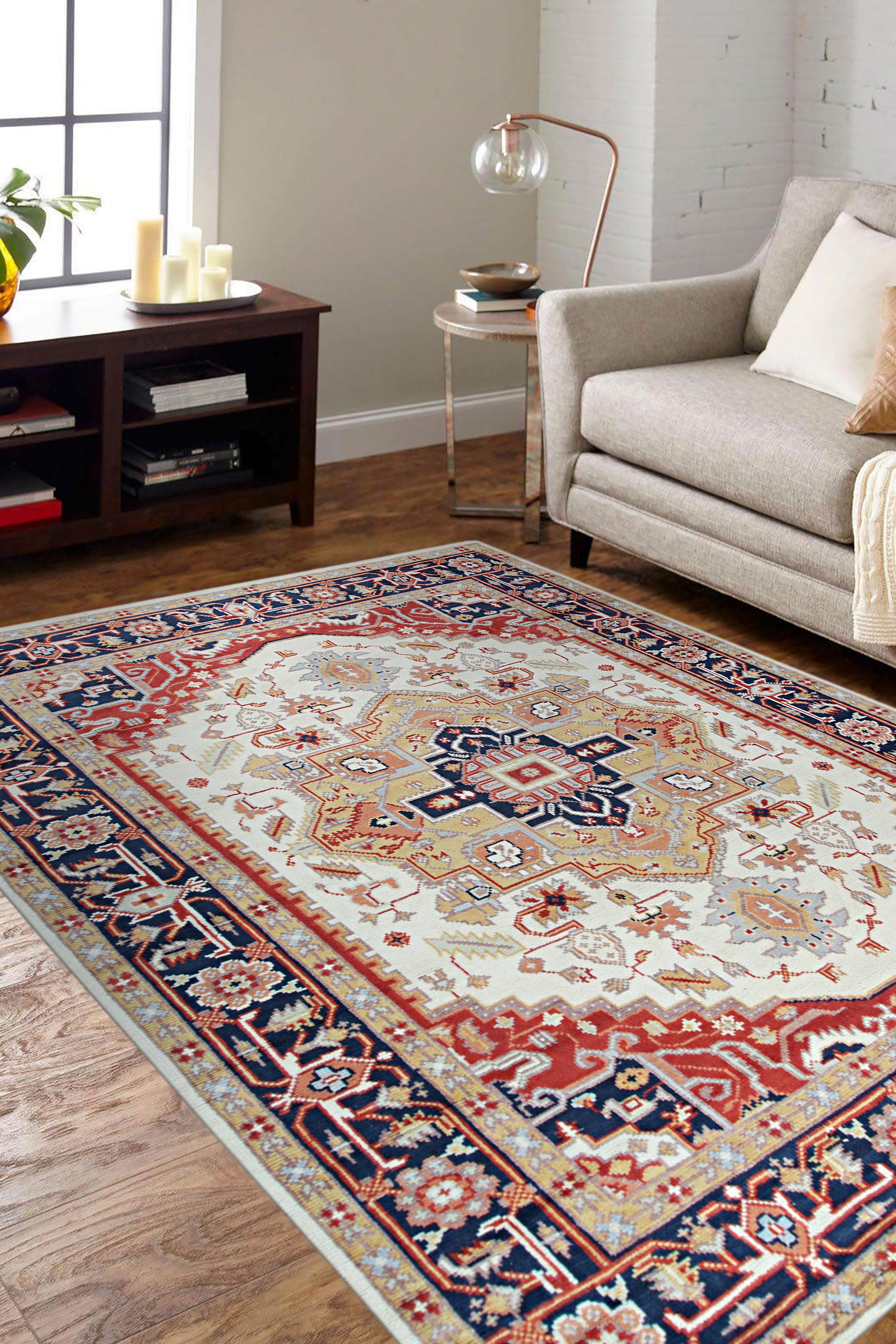 Classic Elegant Blue Hand-Knotted Wool Rug, its intricate traditional pattern rendered in shades of blue against a cream background, displayed in a bright living room setting with neutral furniture.