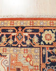 Exquisite Traditional Red Hand Knotted Wool Rug, vibrant red wool floor covering featuring intricate traditional patterns, displayed within a room setting.