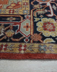 Exquisite Traditional Red Hand Knotted Wool Rug, a vibrant red wool rug with intricate traditional patterns, seen in a brightly lit room showcasing its detail and craftsmanship.