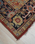 Exquisite Traditional Red Hand Knotted Wool Rug, rich red wool floor covering with intricate traditional patterns, filling a warmly lit room with subtle variations in pile height and detail.