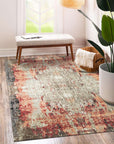 Isla Sumptuous Gray Hand Knotted Wool Rug, its soft gray tones and hand-knotted texture subtly enriching a living room space with a modern gray sofa and wood flooring.