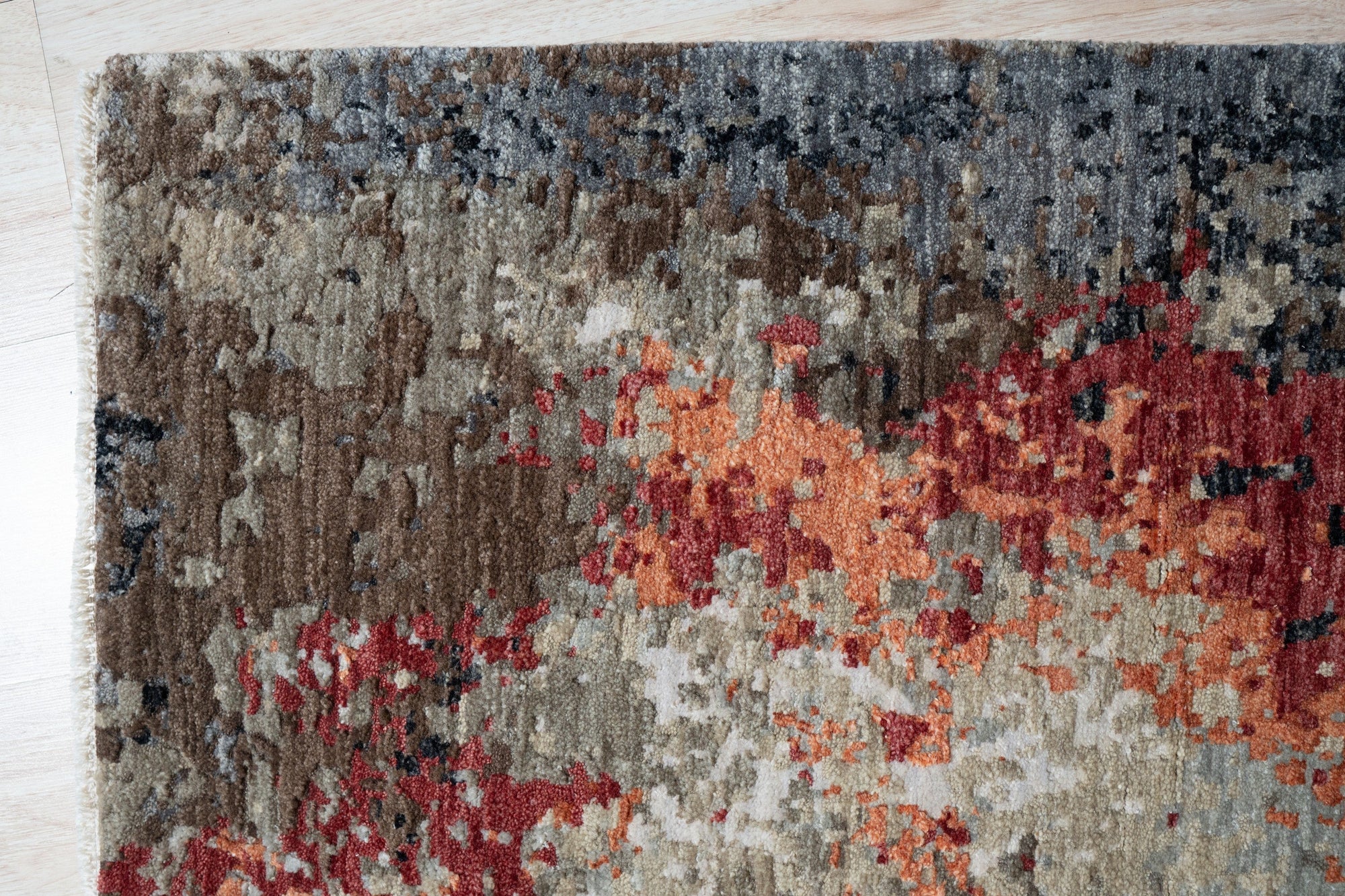 Isla Sumptuous Gray Hand Knotted Wool Rug, blending subtle textures in muted gray tones, anchors a contemporary living space with warmth and understated elegance.