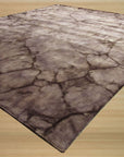 Artistic Violet Brown Hand Knotted Wool Rug, warm violet and brown hues blend in a hand-knotted wool construction, seen in a bright, inviting interior space, enhancing the room's aesthetic.