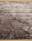 Artistic Violet Brown Hand Knotted Wool Rug, showcasing intricate violet and brown patterns in a hand-knotted wool construction, displayed in a well-lit interior setting.