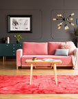 Sarrah Giselle Pink Hand Knotted Wool Rug, displaying a soft pink palette and intricate hand-knotted construction, partially visible in a room setting suggesting home decor inspiration.
