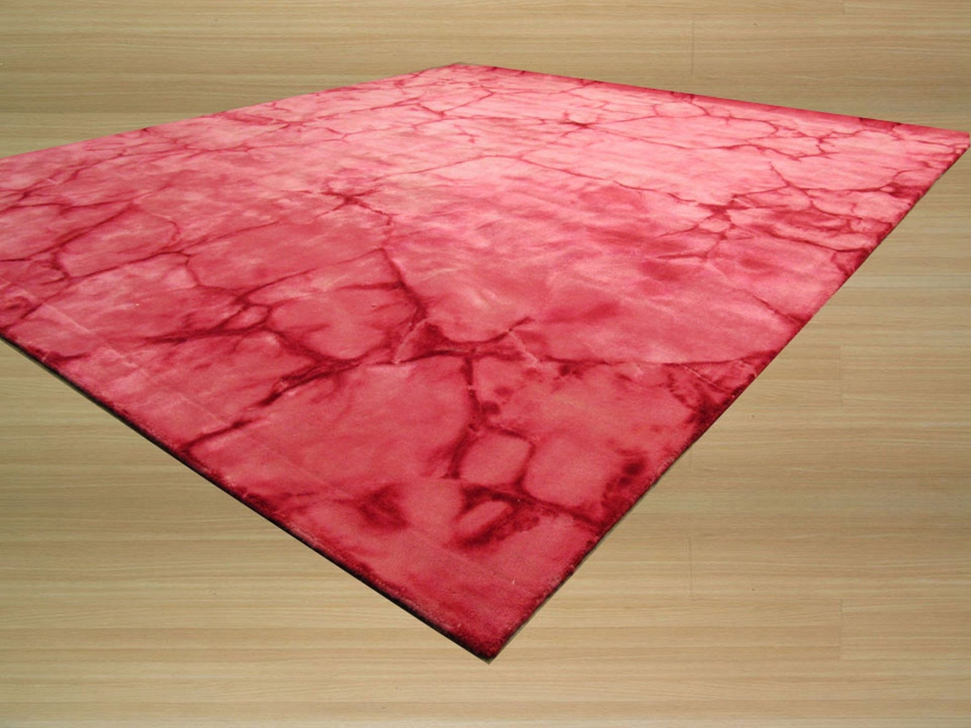 Sarrah Giselle Pink Hand Knotted Wool Rug, showcasing a detailed floral pattern in shades of pink, cream, and gray, creating a soft and luxurious feel in a bright, modern living space.
