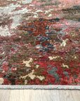 Lydia Lila Multicolor Hand Knotted Wool Rug displayed, showcasing vibrant hues and intricate knotting detail, suggesting warmth and texture.