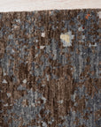 Lydia Lila Multicolor Hand Knotted Wool Rug, vibrant waves of lilac, pink, cream, and blue intertwine in this hand-knotted wool rug, adding a splash of artistic warmth to a modern living space.