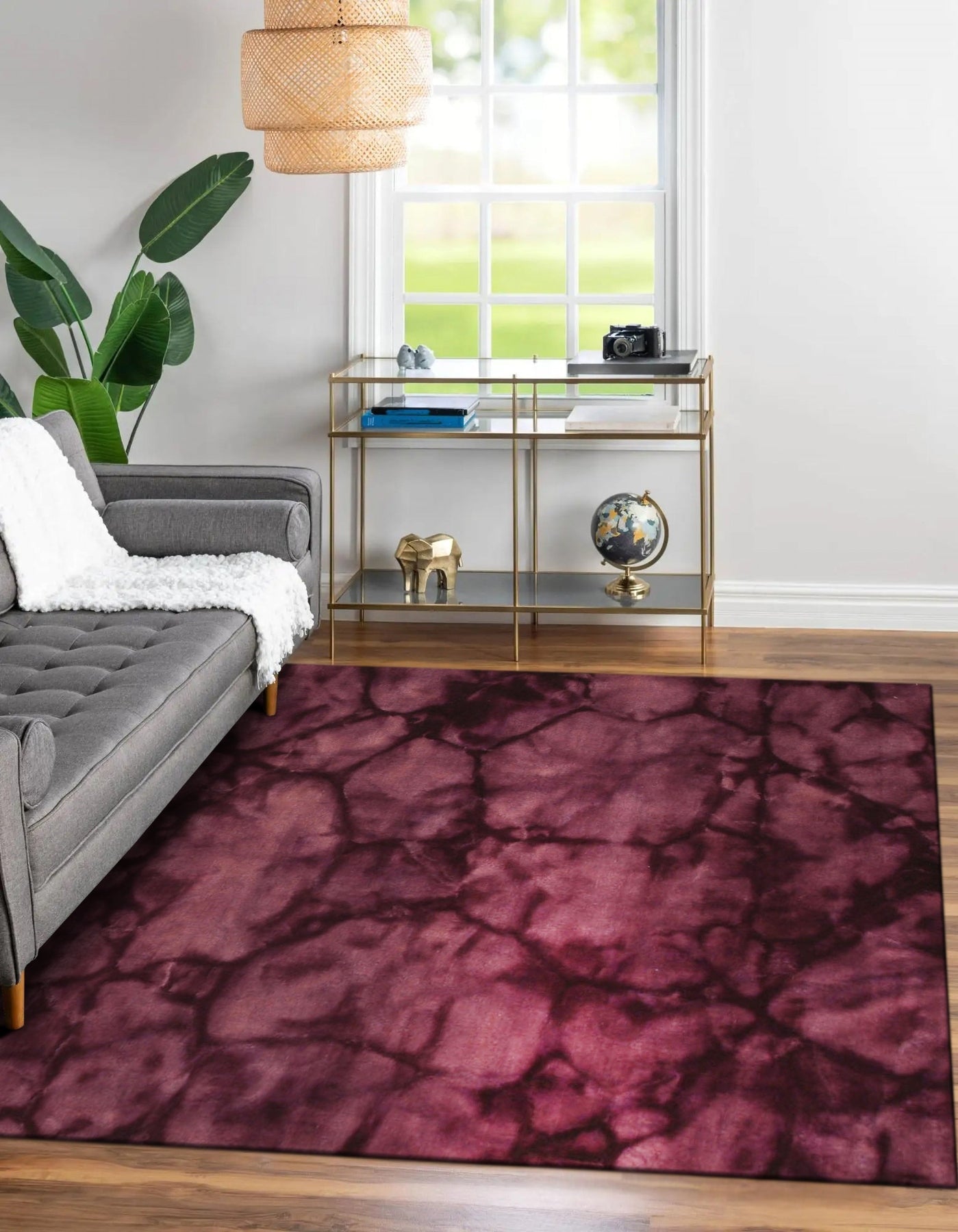 Opulent Rhea Purple Hand Knotted Wool Rug, showcasing its deep purple hues and intricate hand-knotted design, lying flat on a neutral surface.