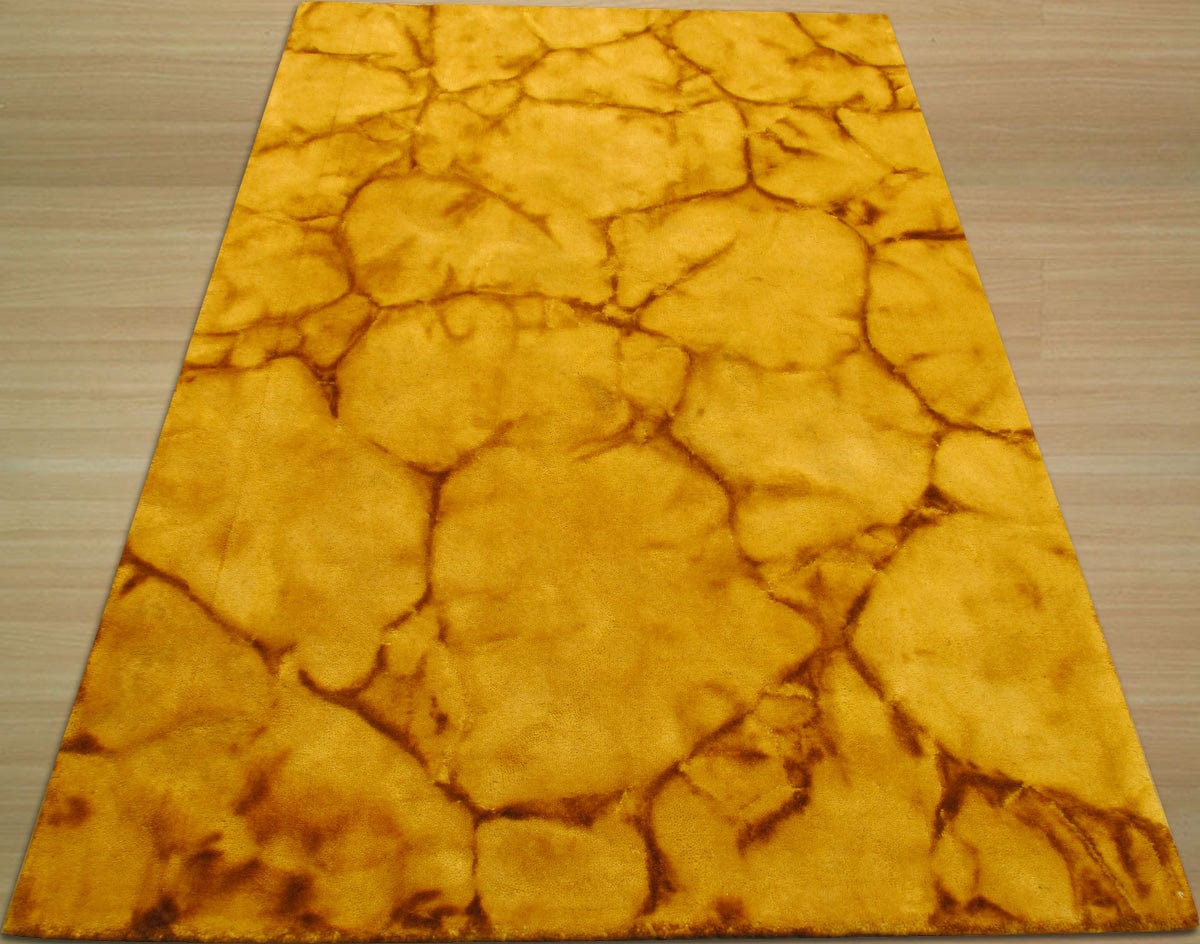 Yara Sarrah Gold Hand Knotted Wool Rug, its subtle gold tones and intricate hand-knotted details displayed within a warm, inviting living room setting.