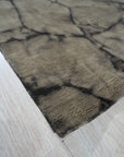 Luxurious Warm Brown Hand Knotted Wool Rug, showcasing intricate knotwork in warm brown tones, creating a textured and inviting floor covering in a home setting.