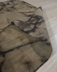 Luxurious Warm Brown Hand Knotted Wool Rug, a hand-knotted wool rug in a warm brown hue, elegantly complements a light-filled living space with hardwood floors.