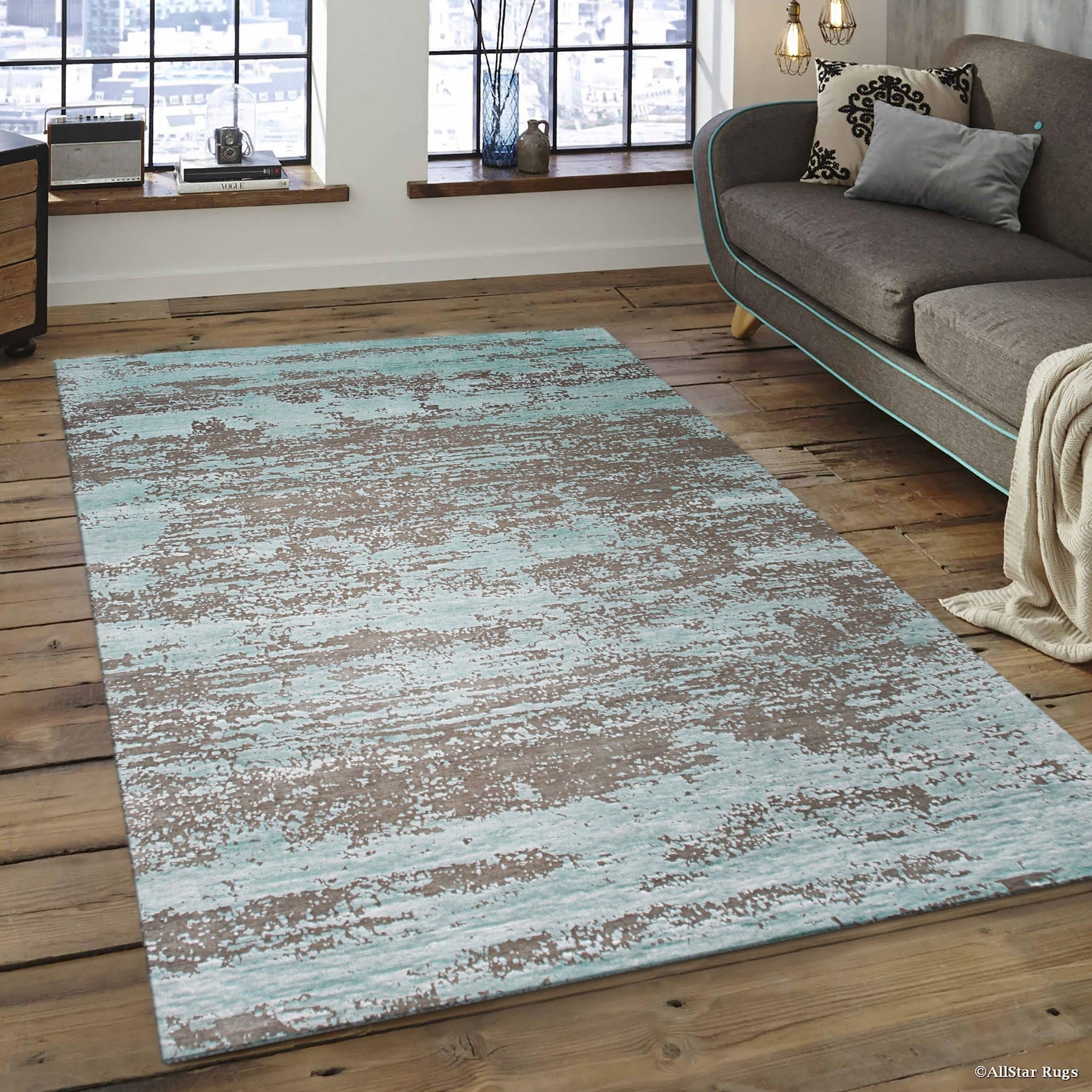 Amara Captivating Silver Hand Knotted Wool Rug, a hand-knotted wool rug in shimmering silver tones, softly textures a modern living space.