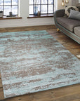 Amara Captivating Silver Hand Knotted Wool Rug, a hand-knotted wool rug in shimmering silver tones, softly textures a modern living space.