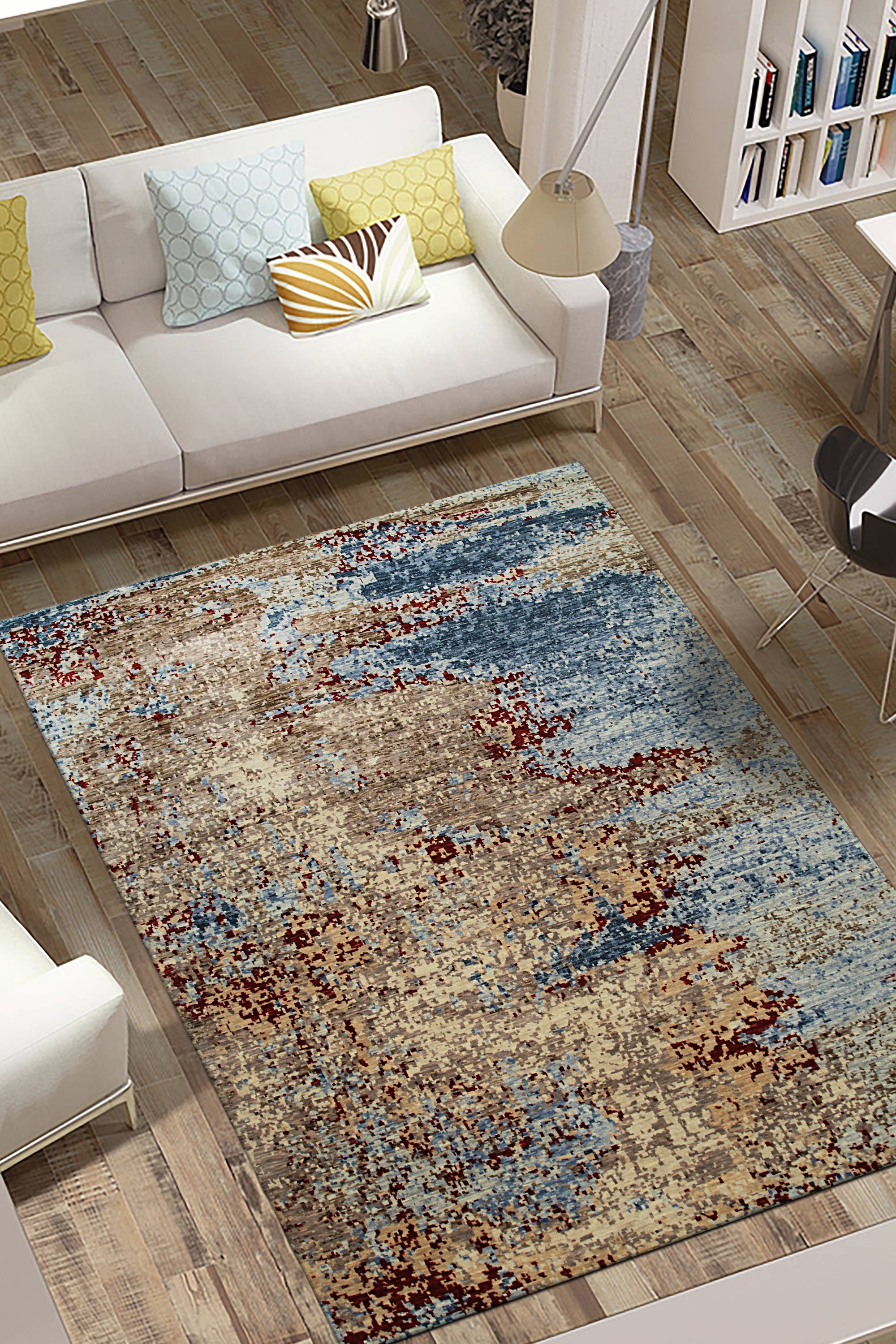 Rustic Fiona Gray Hand Knotted Wool Rug, a soft gray wool rug with a subtly distressed, vintage-inspired pattern, layered in a modern living room setting.