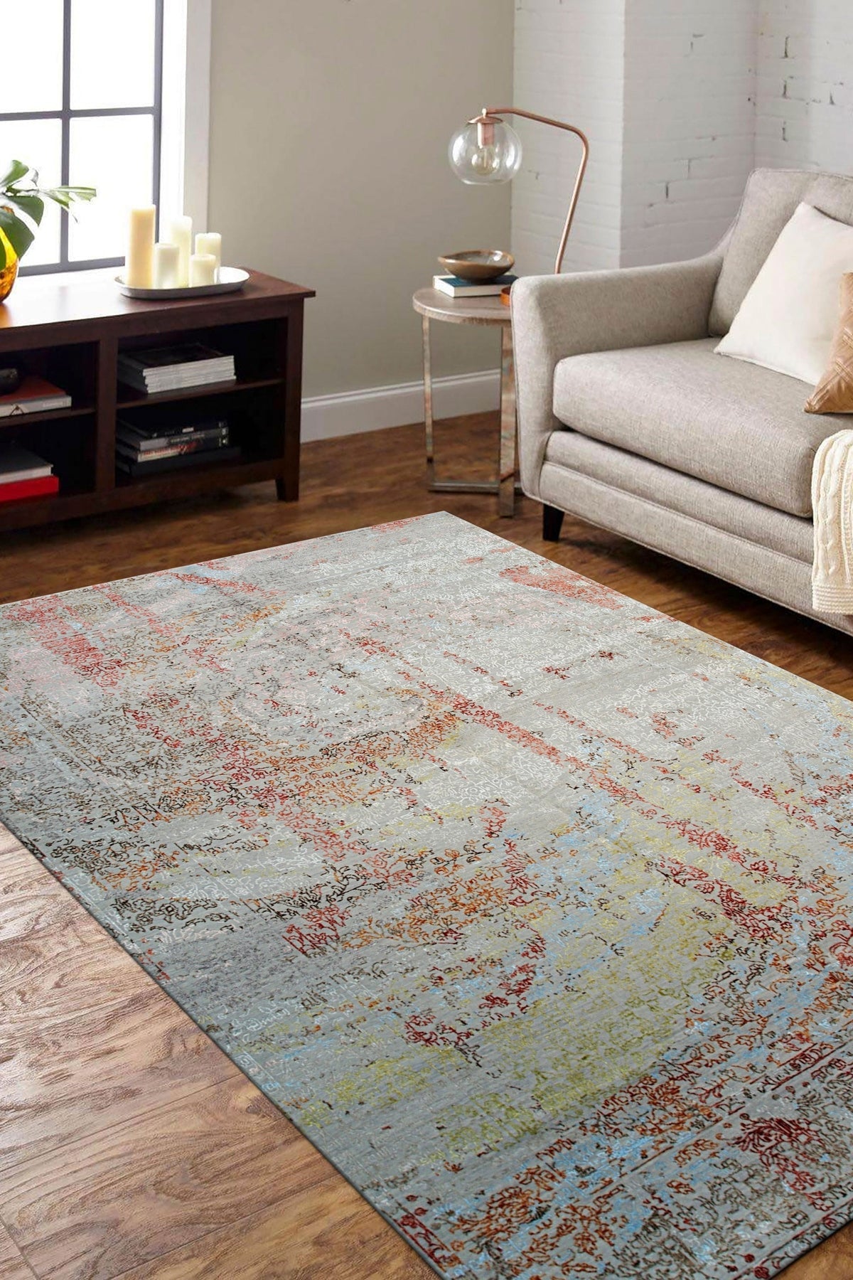 Handcrafted Silver Hand Knotted Wool Rug, "Violet," seen in a brightly lit room; luxurious wool pile gleams with a subtle silver sheen, intricate hand-knotted design blends modern style with traditional craftsmanship.
