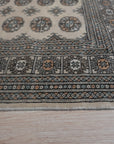 Rustic Nina Beige Nan Rug displaying a textured, neutral palette. Subtle variations in beige create a rustic, lived-in feel. Rug's woven construction and Nan detailing add visual interest to any space.