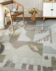 Nina Oriental Multicolor Hand Knotted Wool Rug, vibrant colors and intricate oriental patterns enliven this hand-knotted wool rug, displayed against a light background, highlighting its texture and rich detailing.