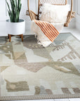 Nina Oriental Multicolor Hand Knotted Wool Rug, its vibrant hues of red, blue, and gold illuminating a living room setting; intricate oriental patterns dance across the hand-knotted wool construction, adding warmth and texture.