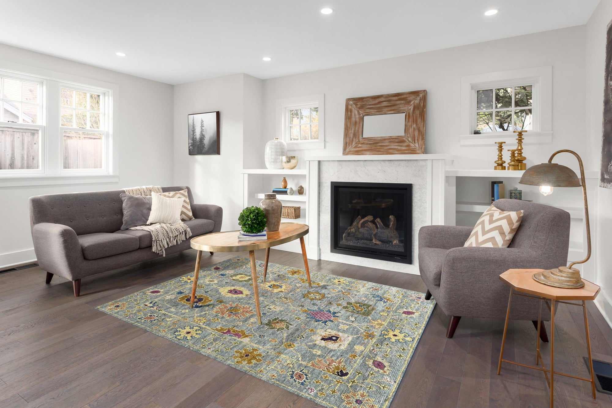 Talia Lila Gray Hand Knotted Wool Rug, a blend of soothing gray and subtle lilac hues in a textured, hand-knotted wool construction, lays elegantly on a light hardwood floor.