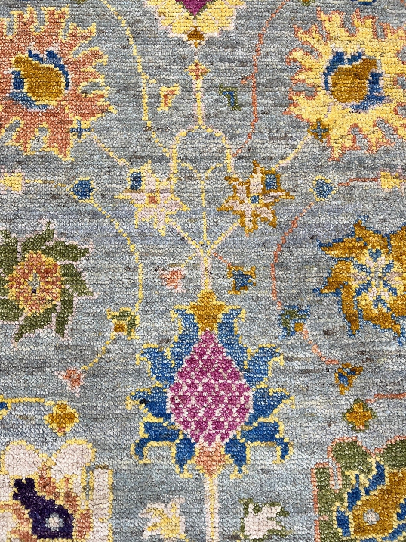 Talia Lila Gray Hand Knotted Wool Rug, a blend of muted lilacs and grays hand-knotted in wool, softens a modern living space.