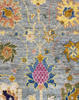 Talia Lila Gray Hand Knotted Wool Rug, a blend of muted lilacs and grays hand-knotted in wool, softens a modern living space.
