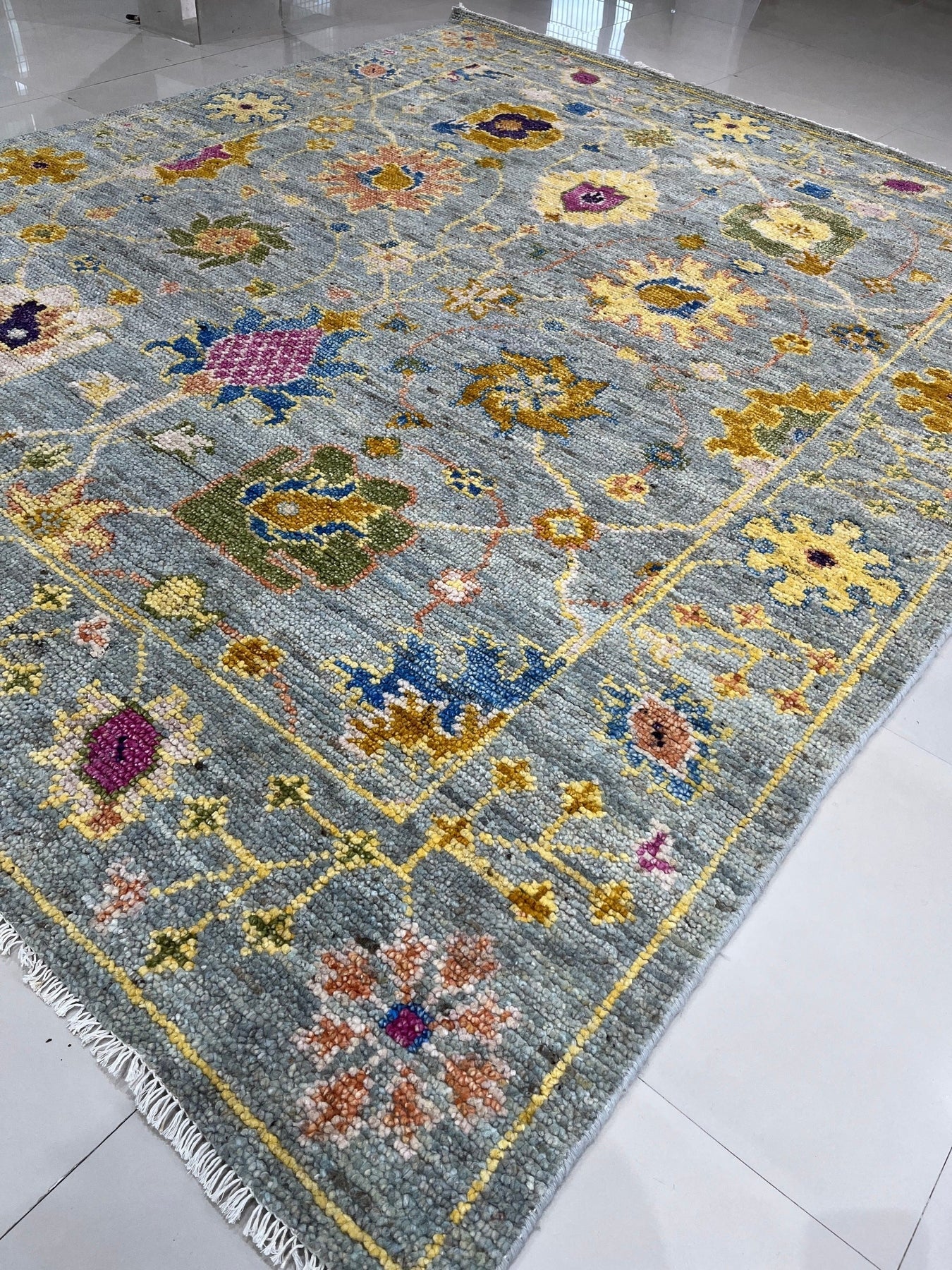 Talia Lila Gray Hand Knotted Wool Rug, showcasing intricate geometric patterns in shades of gray and lilac, elegantly positioned in a living room setting.