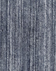 Delicate Striped Charcoal Handmade Wool Rug, features charcoal stripes woven into handmade wool, creating a textured and modern floor covering in a living room setting with neutral furniture.
