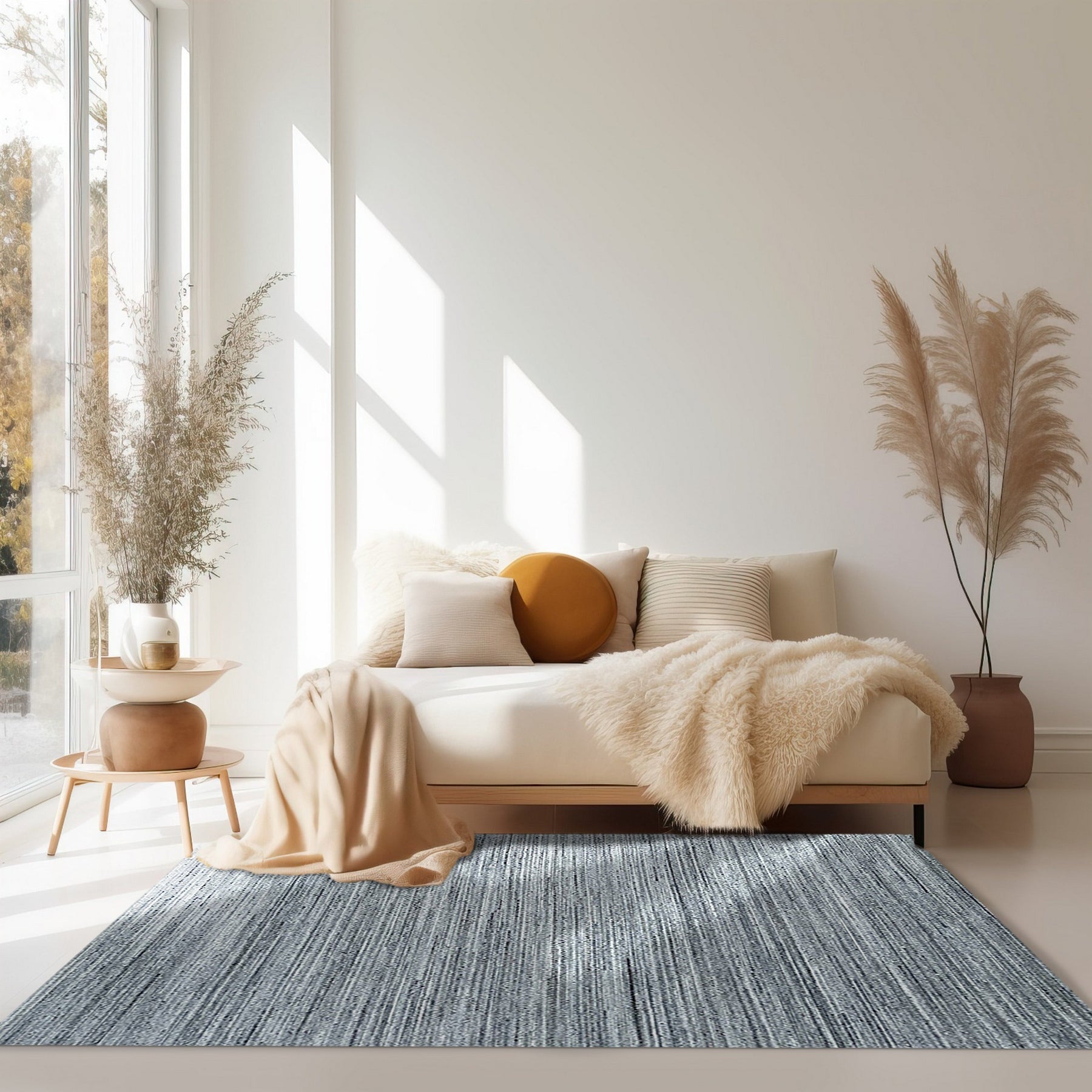 Delicate Striped Gray Handmade Wool Rug displayed on a light hardwood floor. Soft gray stripes run horizontally across the wool rug, creating a subtle, textured pattern.