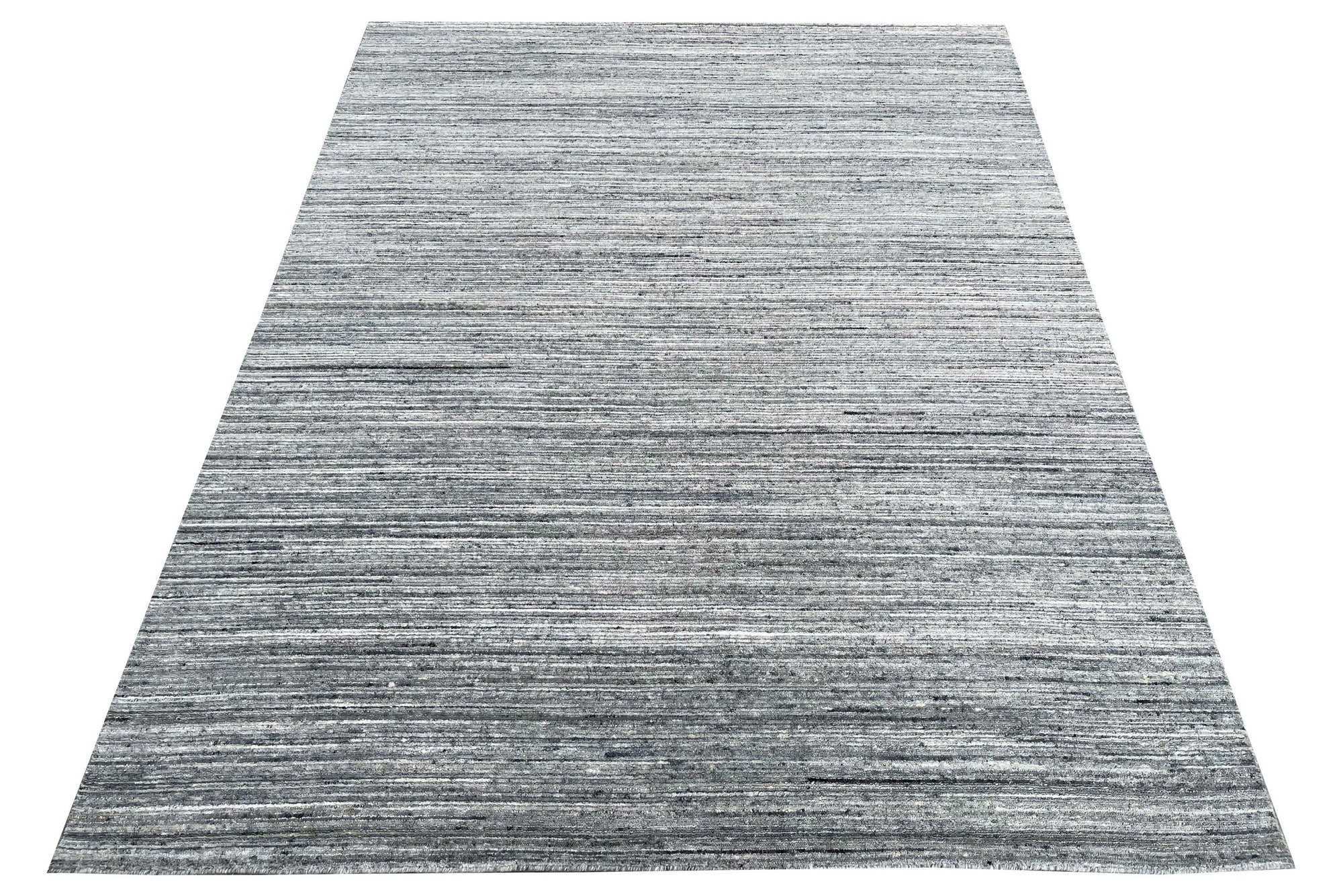 Delicate Striped Gray Handmade Wool Rug, a soft, textured wool rug with alternating shades of gray stripes, subtly hand-woven, lying flat on the floor.