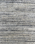 Delicate Striped Ivory Handmade Wool Rug, showcasing soft ivory hues and subtle stripes in a warm, inviting living space.