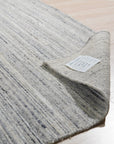 Delicate Striped Ivory Handmade Wool Rug, soft ivory wool with subtle stripes, presented in a bright, inviting living space.