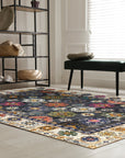 Lila Ruby Charcoal Hand Knotted Wool Rug, charcoal, ruby, and cream tones softly blend in a hand-knotted wool rug with subtle abrash, shown on hardwood floor.