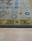 Maya Kazak Charcoal Hand Knotted Wool Rug, its intricate geometric pattern rendered in shades of charcoal wool, lies flat revealing depth and texture in its hand-knotted construction.