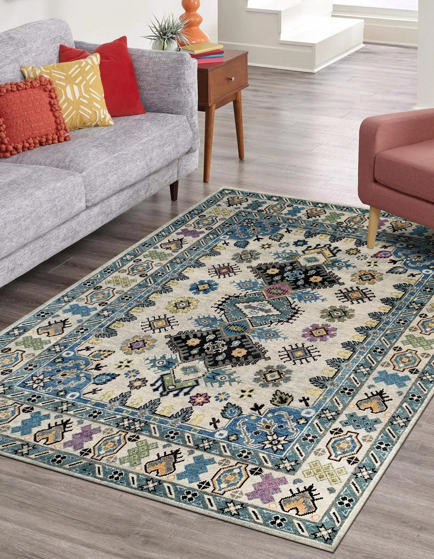 Cozy Lydia Beige Hand Knotted Wool Rug, a soft beige wool rug with subtle variations in tone, lays elegantly on a light hardwood floor, hinting at warmth and comfort.