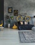 Maya Oushak Silver Hand Knotted Wool Rug, showcasing its intricate silver and neutral toned pattern across a soft wool texture, displayed in a brightly lit living space.