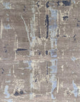 Isolated view of Clara Stylish Gray Hand Knotted Wool Rug, showcasing its intricate geometric diamond pattern woven in shades of gray and cream, highlighting the rug's soft texture and hand-knotted construction.