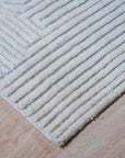 Celia Lila Ivory Hand Knotted Wool Rug, its delicate lilac and ivory hues blending in a sophisticated floor covering. Hand knotted wool construction offers texture and depth.