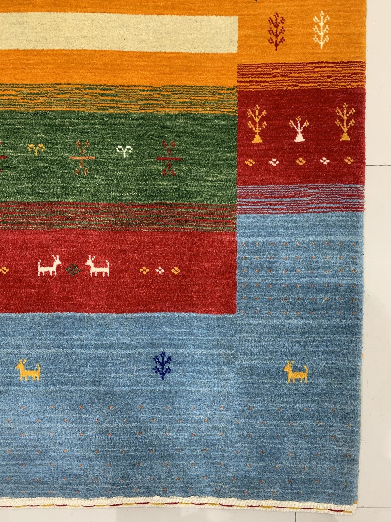 Timeless Gabbeh Blue Handmade Wool Rug, vibrant blue wool with a traditional Gabbeh design, fills the frame showcasing its texture and color variations.