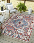 Rustic Isla Gray Hand Knotted Wool Rug, its intricate knotting and subtle gray tones anchoring a bright, airy living room. Soft light highlights the rug's texture beneath a modern coffee table and sofa.