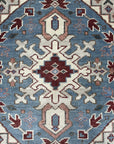 Rustic Isla Gray Hand Knotted Wool Rug, showcasing a subtle, textured gray field with a distressed, vintage-inspired design, adding warmth and understated elegance to a living space.