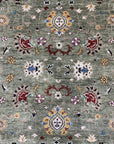 Ophelia Oriental Green Hand Knotted Wool Rug, a richly detailed wool rug with a classic oriental design rendered in verdant greens and earthy tones, displayed in a styled interior setting.