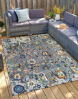 Classic Willow Gray Hand Knotted Wool Rug, displaying a subtle, sophisticated pattern in a warm, inviting living room setting. The wool rug's hand-knotted texture softens the hardwood floor, creating a cozy and elegant ambiance.