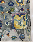 Classic Willow Gray Hand Knotted Wool Rug, a soft gray wool rug hand-knotted with a subtle, timeless design, rests on a light wood floor, its neutral tones creating a serene and inviting space.