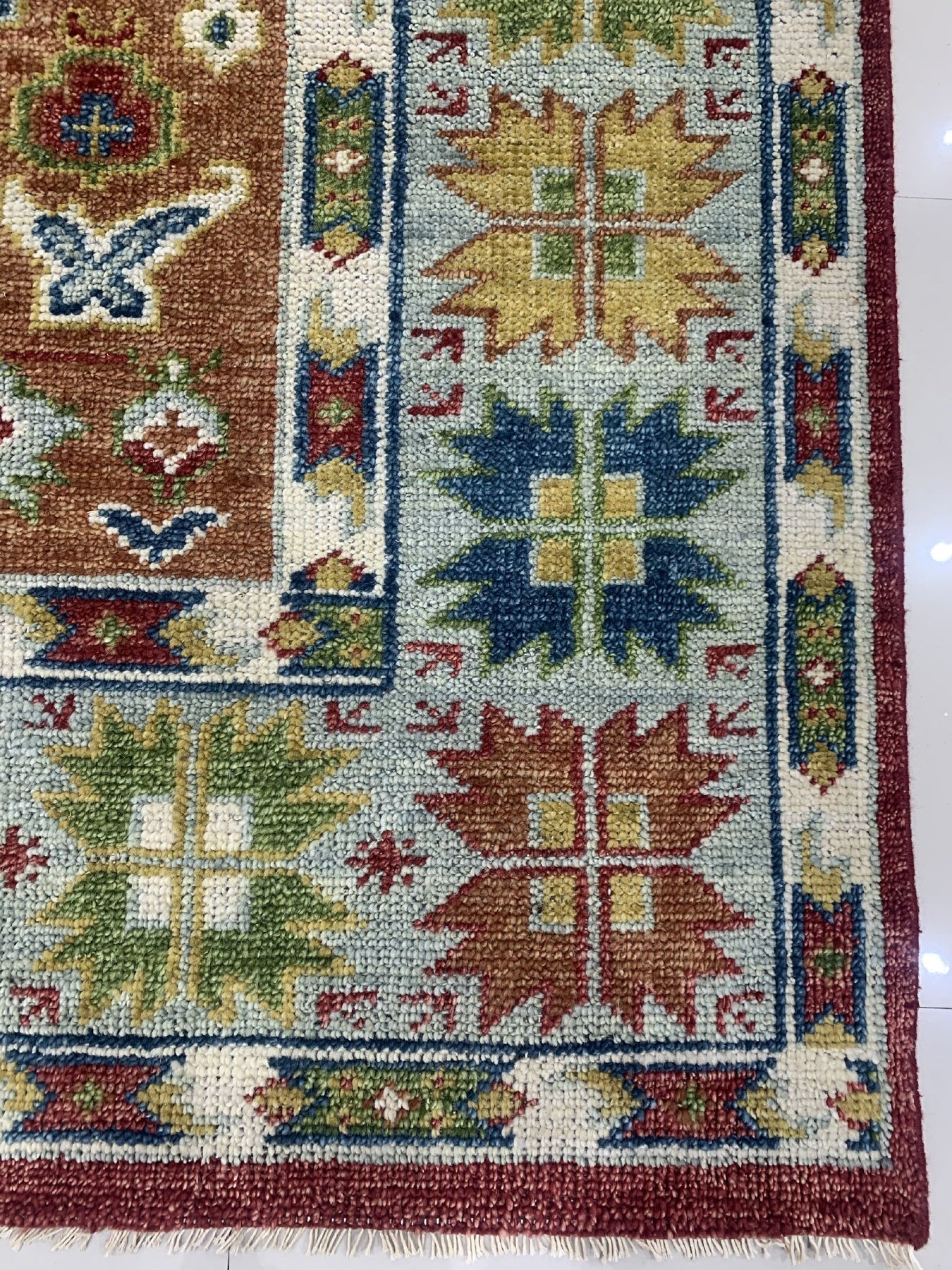 Sophie Chic Red Hand Knotted Wool Rug, vibrant scarlet wool rug with intricate, hand-knotted details, adding a touch of elegance and warmth to a modern living space.