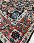 Timeless Oriental Charcoal Hand Knotted Wool Rug, displaying its intricate details and rich charcoal hues, showcased in a well-lit living room setting.