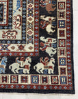 Willow Oriental Charcoal Hand Knotted Wool Rug, its intricate oriental design rendered in shades of charcoal, softening a modern living space.