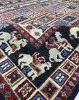 Willow Oriental Charcoal Hand Knotted Wool Rug, a charcoal-toned hand-knotted wool rug featuring an intricate oriental design, displayed within a modern interior setting.