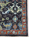 Delicate Oriental Brown Hand Knotted Wool Rug displayed on a light hardwood floor, its intricate floral patterns in shades of brown, beige, and ochre adding warmth and sophistication to the space.